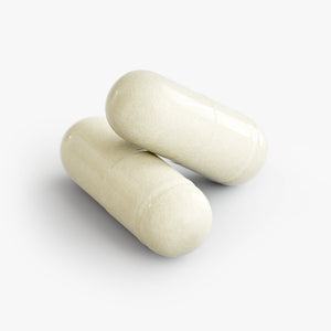 Broad-spectrum digestive enzyme supplement with probiotic strains in capsule form