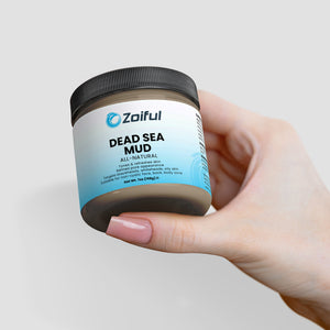 Open jar of Dead Sea mud mask showing rich mud texture